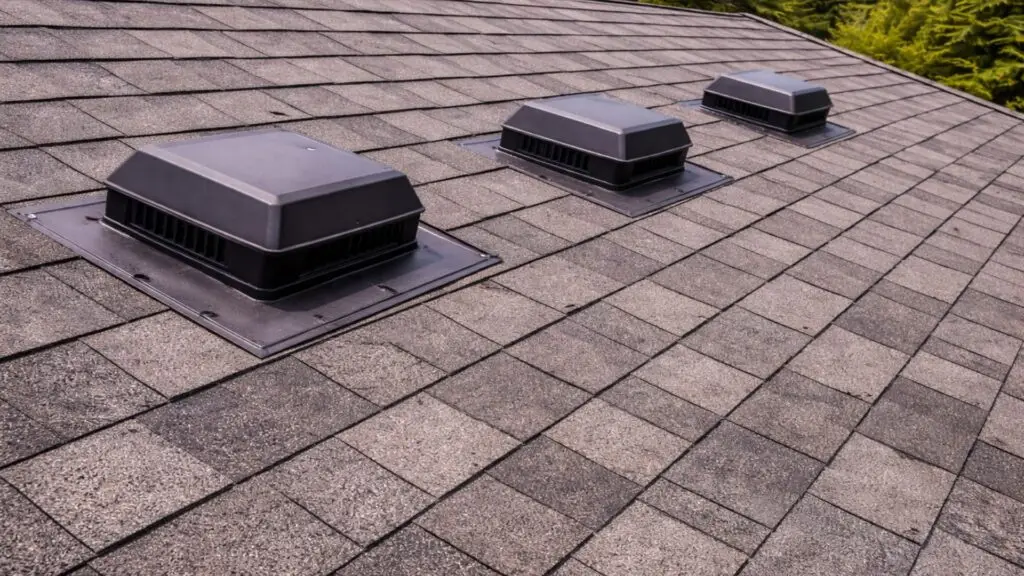 New roof ventilation vent installed on an asphalt shingle roof.